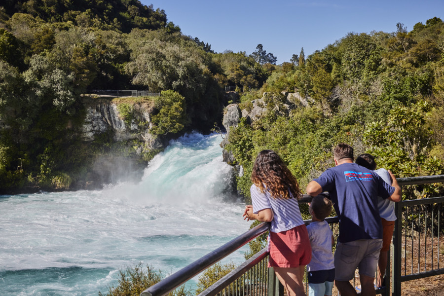 A family looking over a waterfall in Taupo