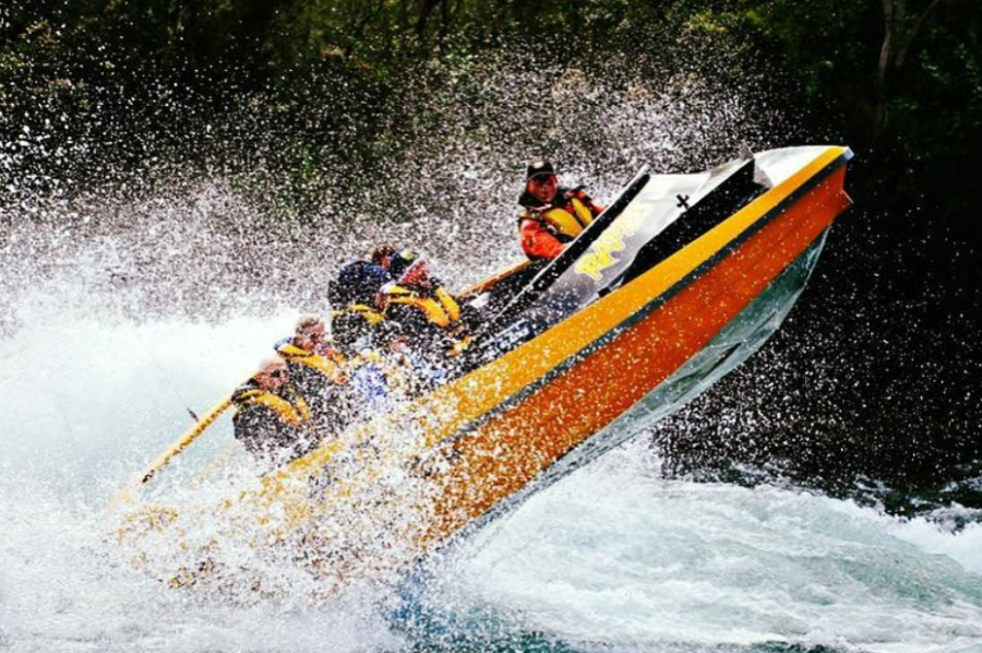 Rapids Jet jet boat catching air over the whitewater